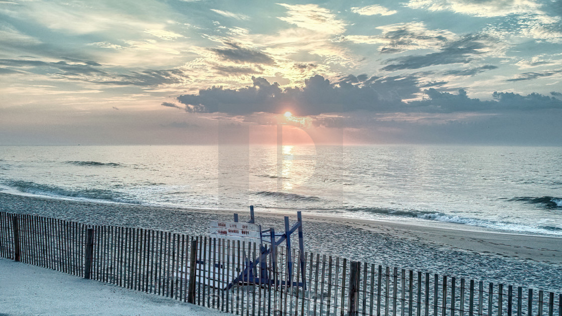 "Sunrise over the lifeguard stand" stock image