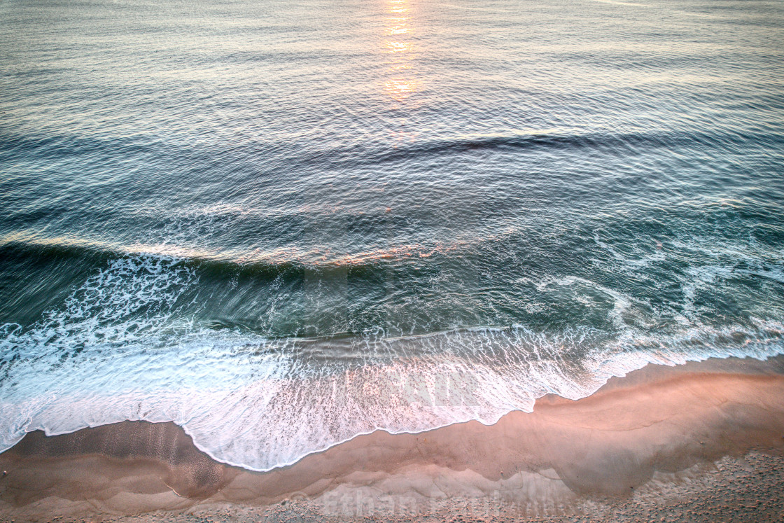 "The first light of the day crashing to shore 1" by Ethan Paul - $18.68 "The first light of the day crashing to shore 1" stock image