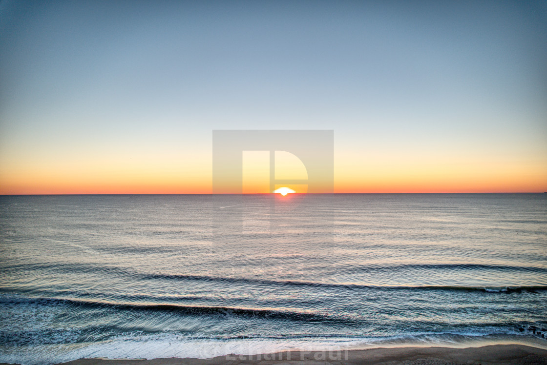 "The first light of the day crashing to shore 2" stock image