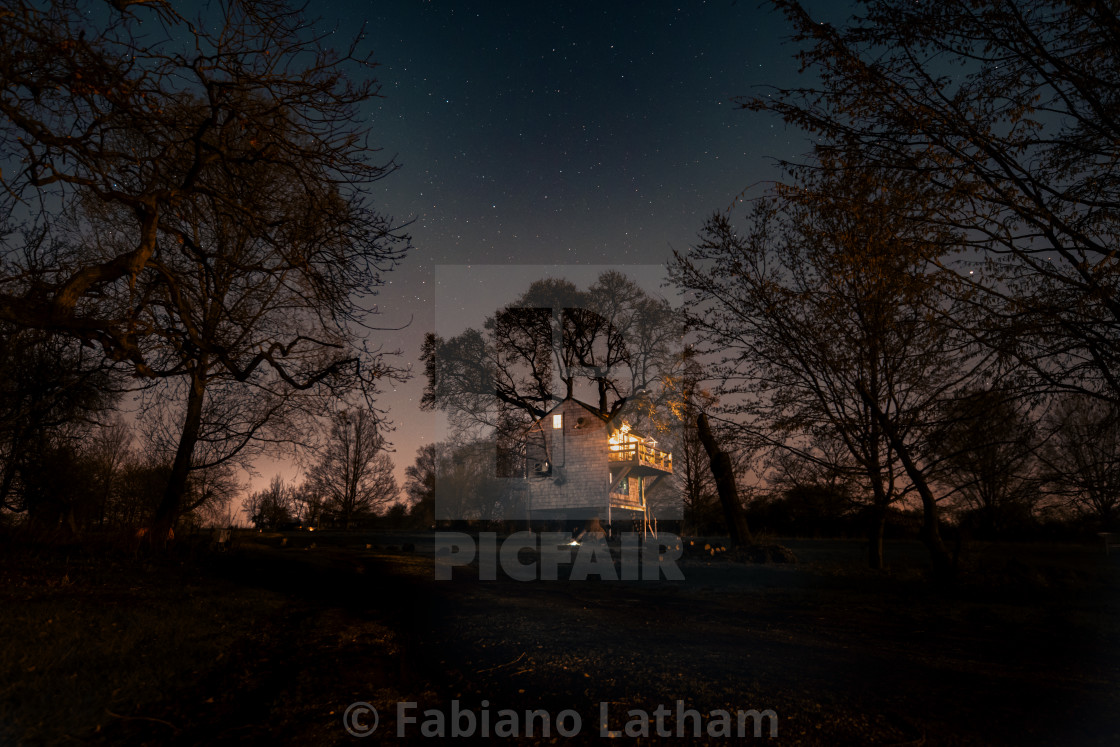 "Tree house at night" stock image