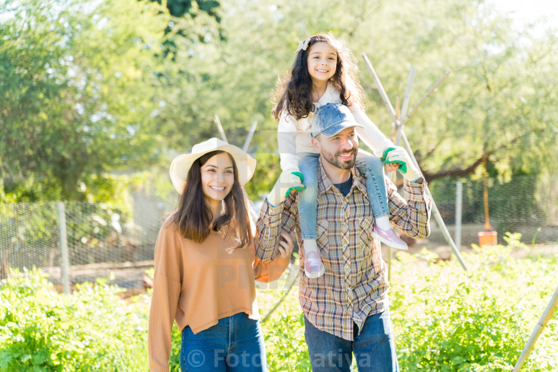"Happy Parents With Daughter At Vegetable Garden" by Foto Creativa - £3.80 "Happy Parents With Daughter At Vegetable Garden" stock image