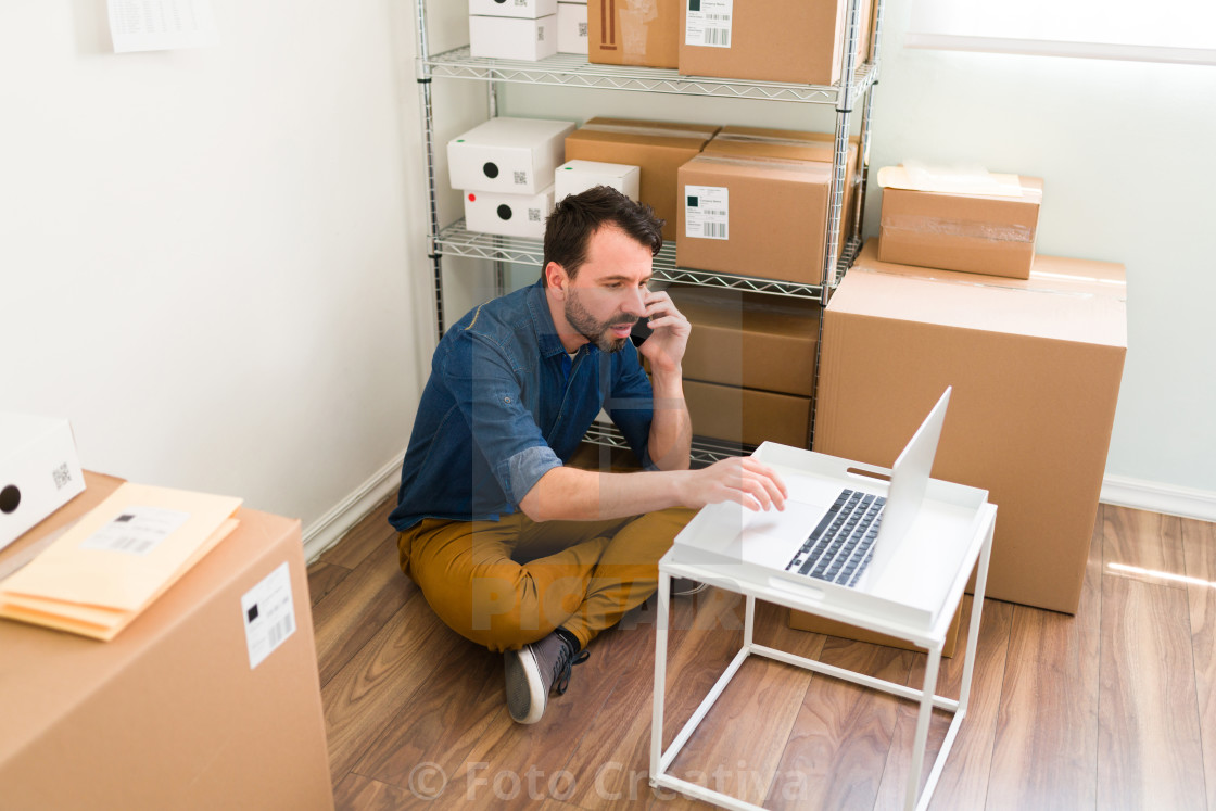 "Entrepreneur talking with tech support about his website" by Foto Creativa - £3.80 "Entrepreneur talking with tech support about his website" stock image
