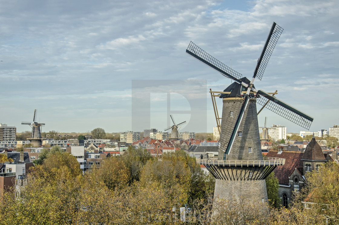 "Windmill and old town" by Frans Blok - $15.41 "Windmill and old town" stock image