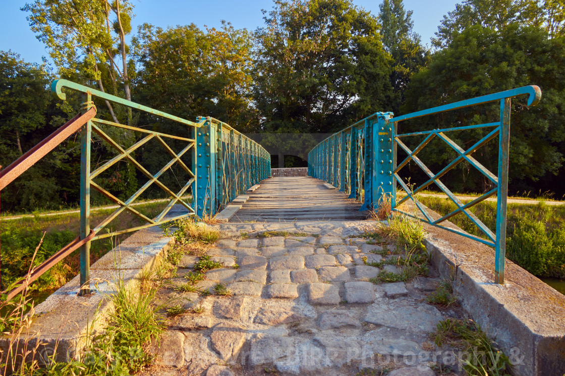 "Iron and timber foot bridge" stock image