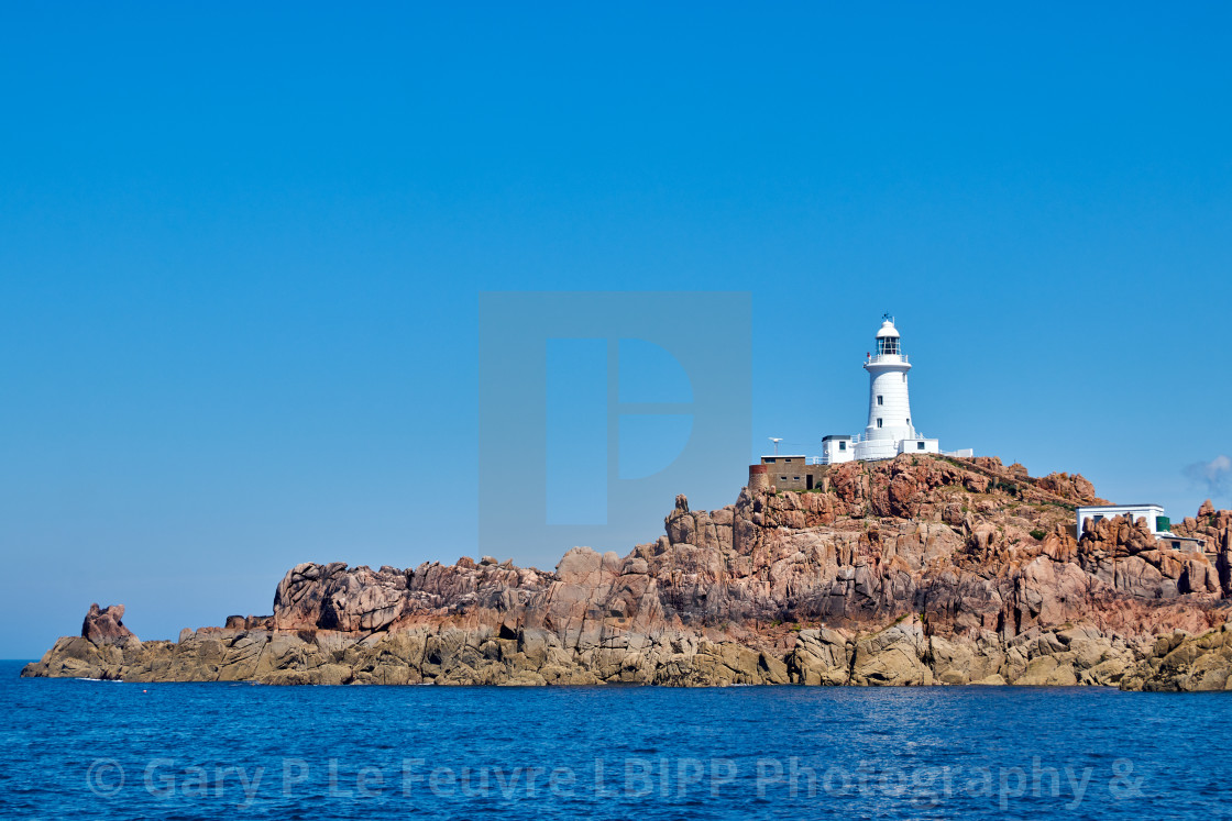 "Corbiere Lighthouse, Jersey Channel Islands, photographed from the sea to the south." stock image