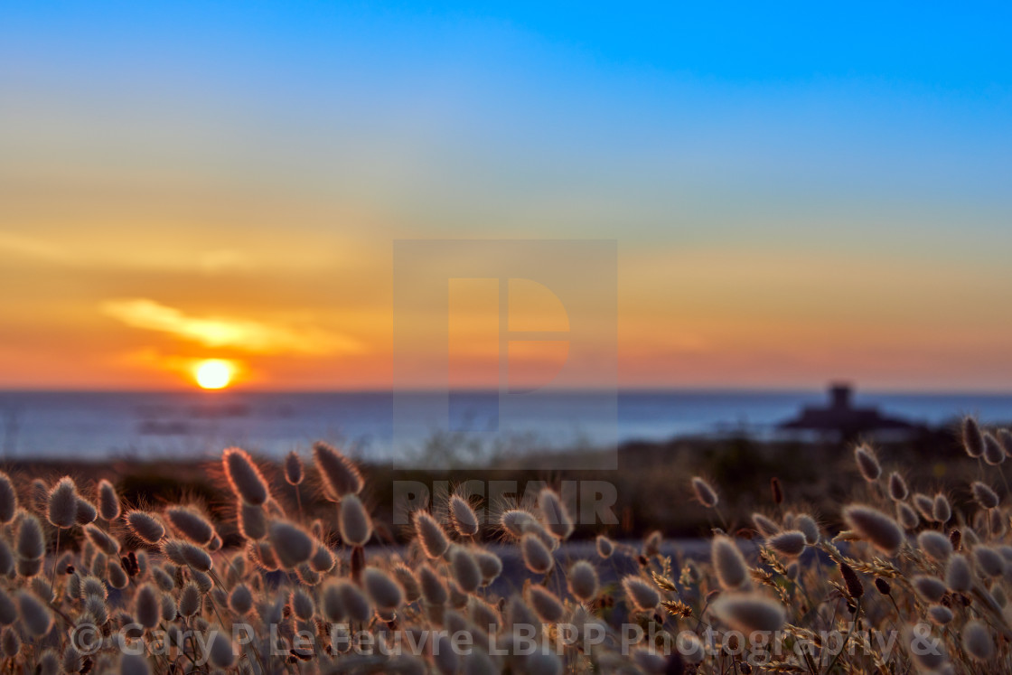 "St Ouens Bay with Rocco Tower" stock image