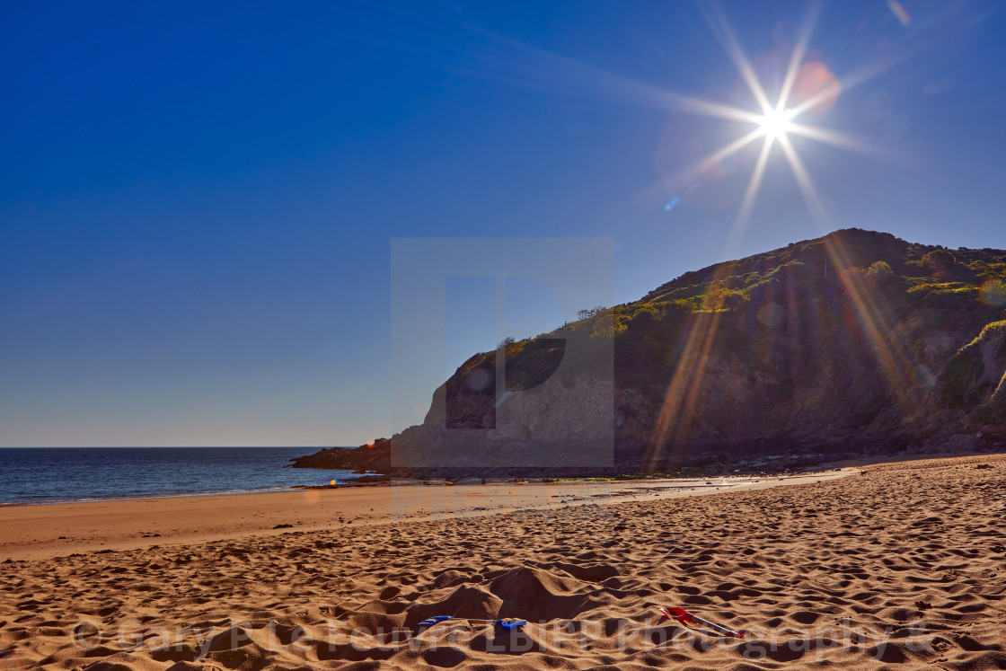 "La Greve de Lecq in the morning summer sunshine" stock image