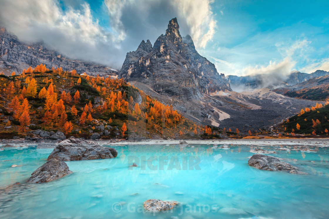 "Autumn alpine landscape with turquoise glacier lake, Sorapis, Dolomites, Italy" stock image