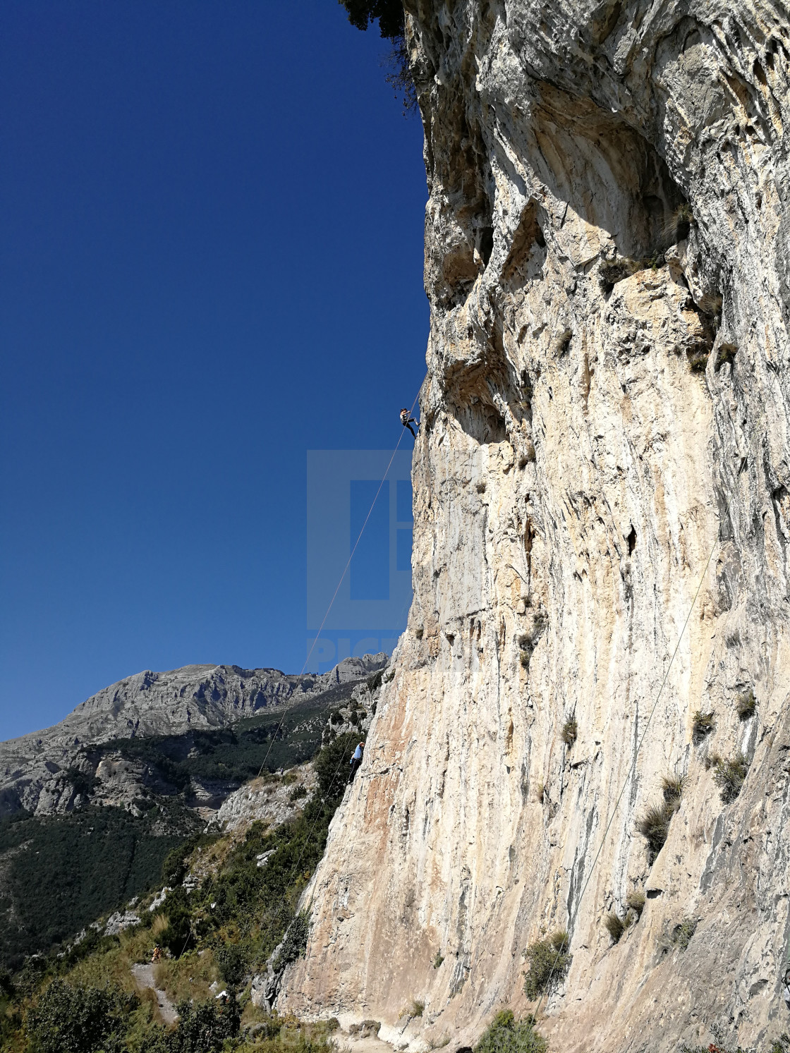 "Arrampicatrice alla Falesia degli Dei" stock image