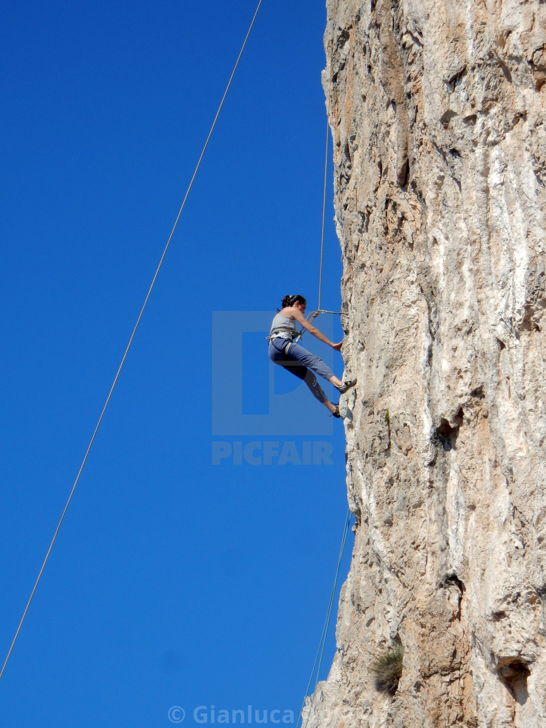 "Arrampicatrice sulla Falesia degli Dei" stock image