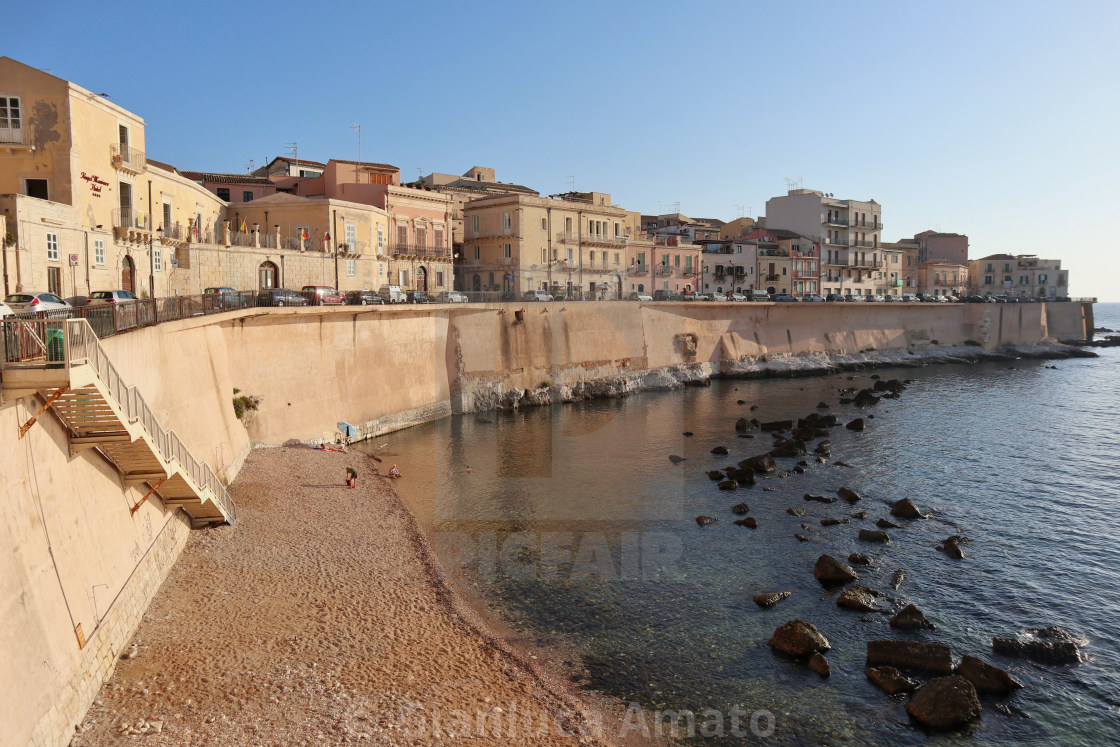 "Siracusa - Spiaggia di Cala Rossa all'alba" stock image