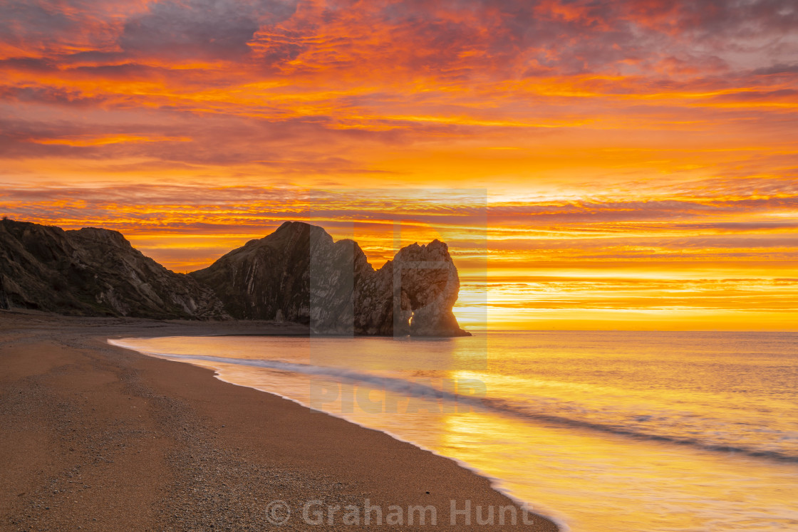 "UK Weather: Durdle Door Sunrise, Dorset, UK." stock image