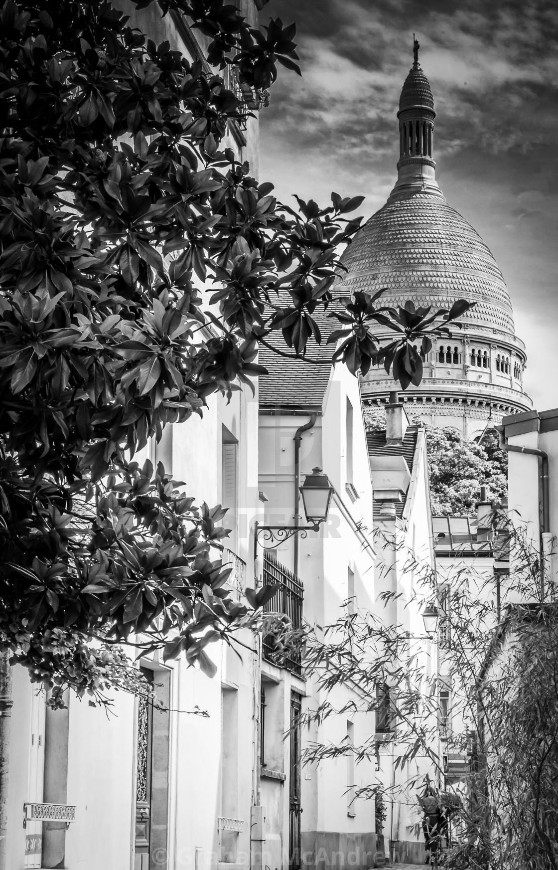 "The Dome of The Basilica of the Sacred Heart of Paris, commonly known as Sacré-Cœur, Monchrome. Seen from the streets of Montmatre" stock image