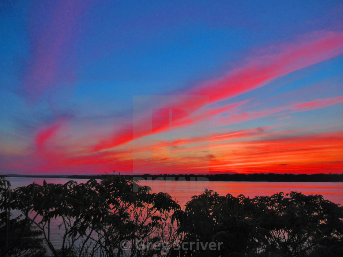 "Red - Orange Sunset glow reflection" stock image