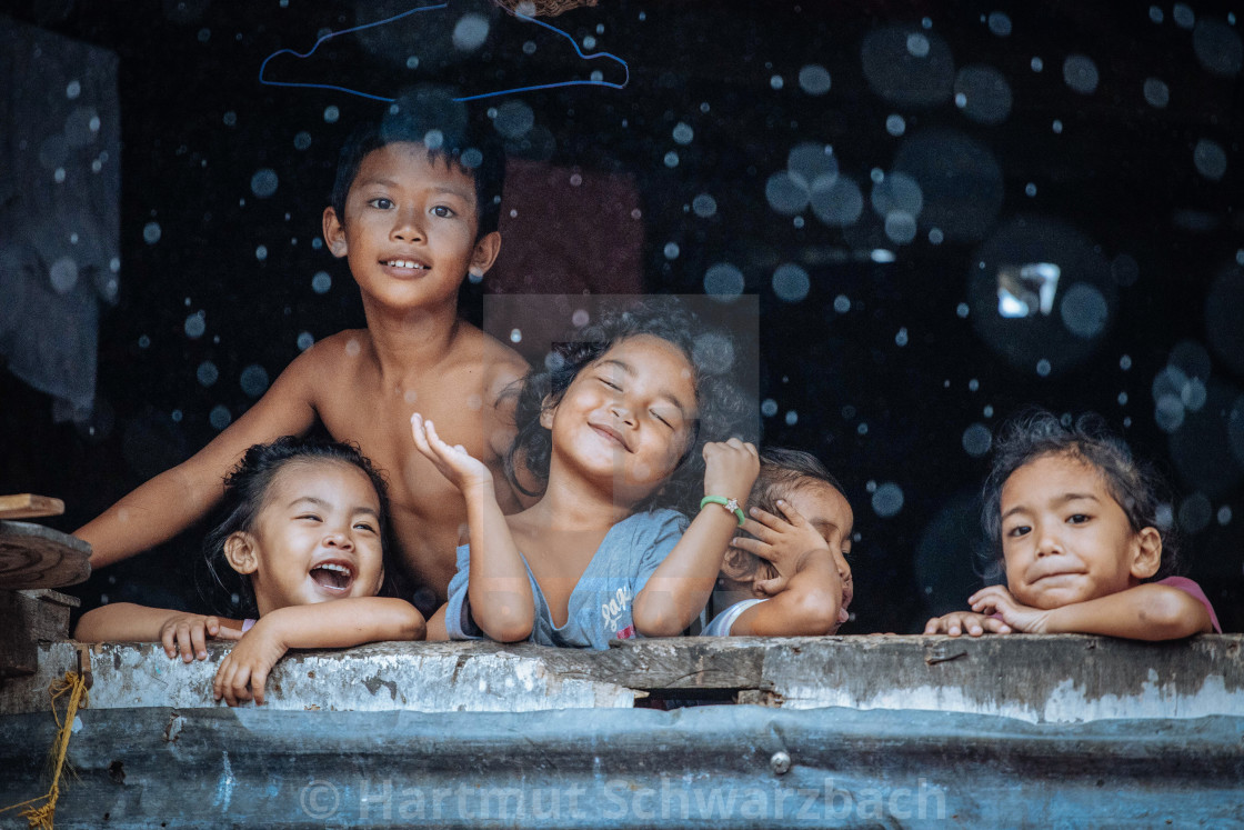 "Children enjoying the rain" stock image