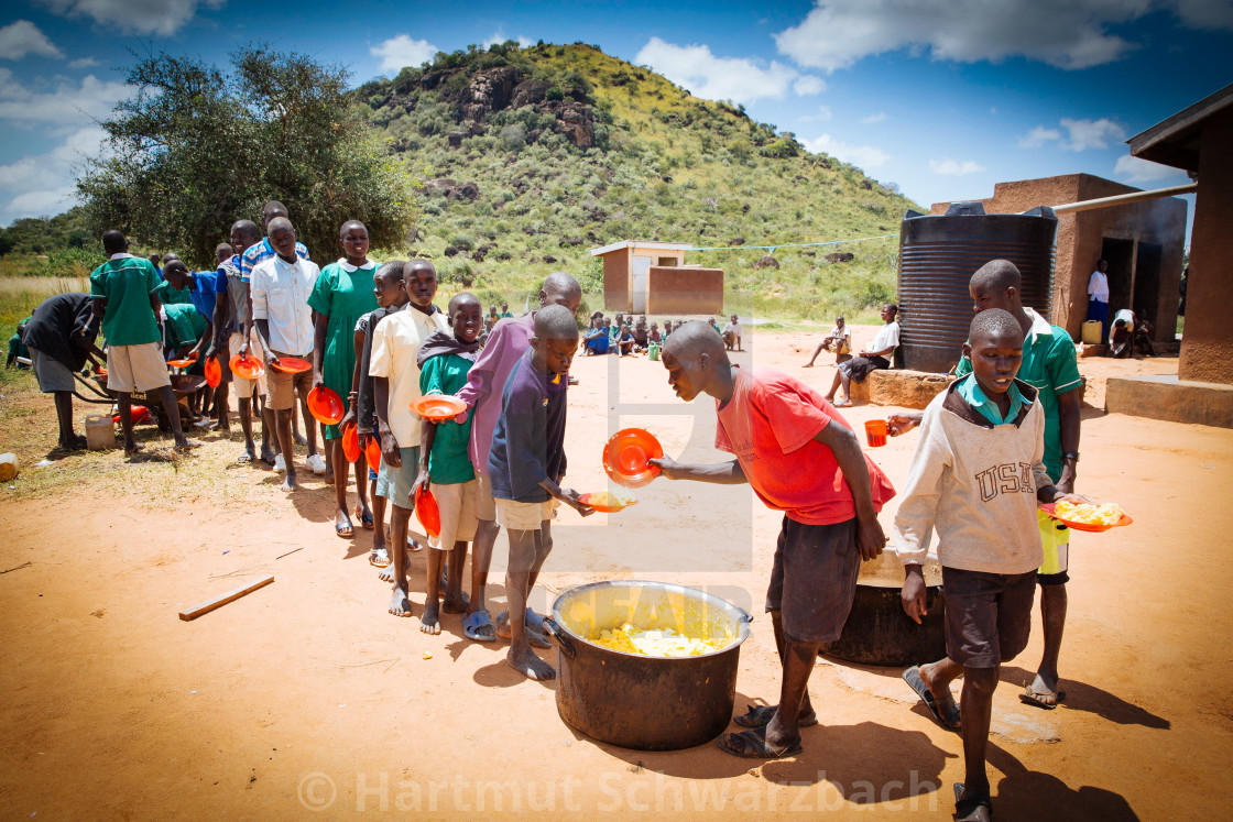 "School lunch in a village school in the rural village of Kotido" stock image