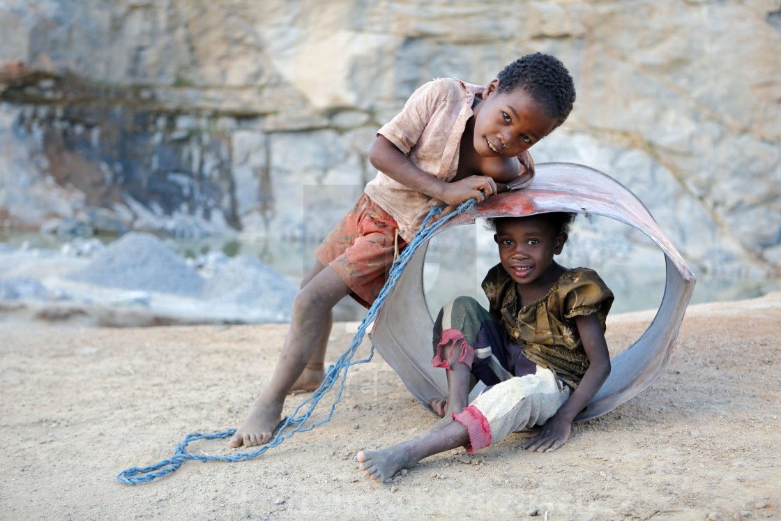 "Children playing in a quarry after work" stock image