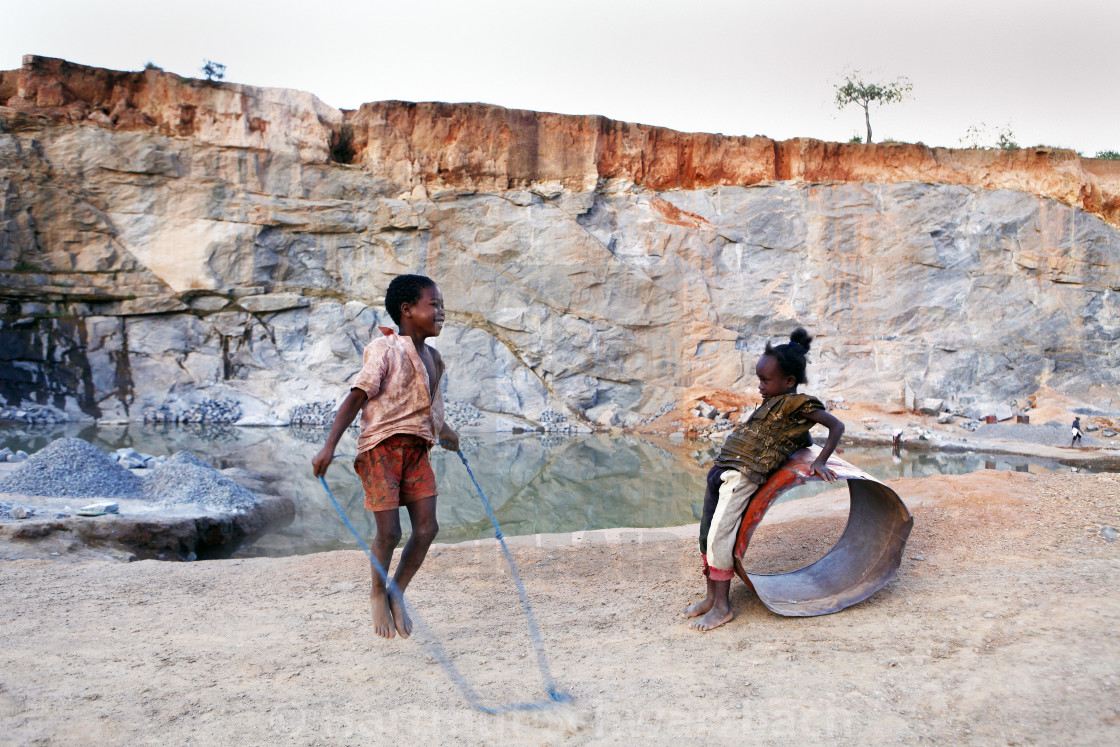 "Children playing in a quarry after work" stock image