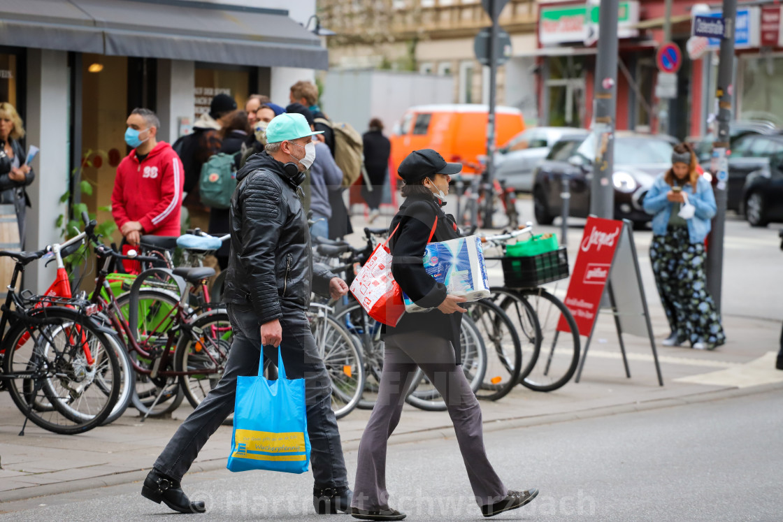 "Shopping with face masks during the Corona Pandemic and Crisis" stock image