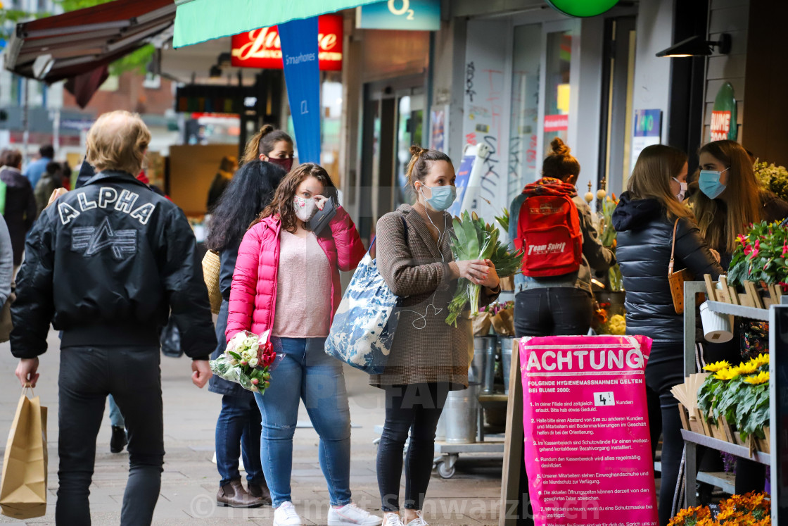 "Shopping with face masks during the Corona Pandemic and Crisis" stock image