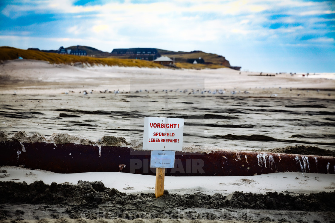 "Sand flushing with heavy equipment to secure the coast and the s" stock image