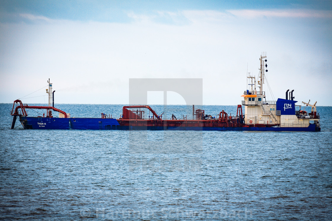 "Sand flushing with heavy equipment to secure the coast and the s" stock image