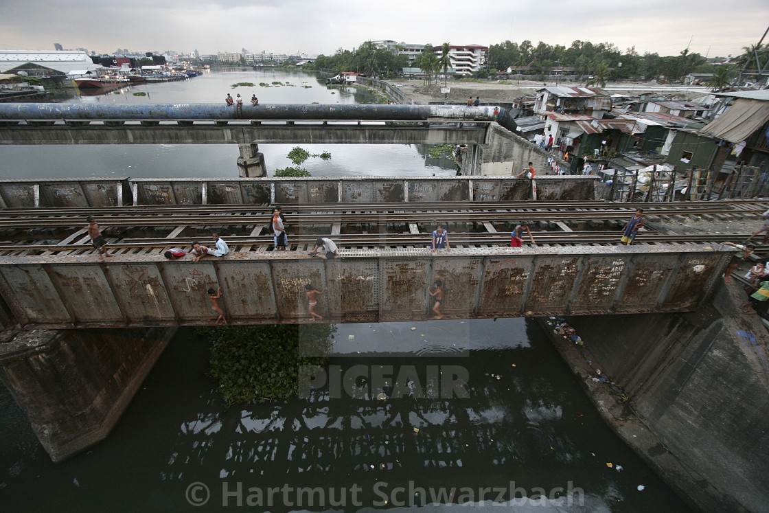 "Manila Killertrain-Dangerous Life in the Slums" by Hartmut Schwarzbach - $54.94 "Manila Killertrain-Dangerous Life in the Slums" stock image