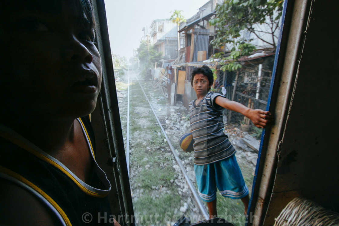 "Manila Killertrain-Dangerous Life in the Slums" by Hartmut Schwarzbach - $56.47 "Manila Killertrain-Dangerous Life in the Slums" stock image