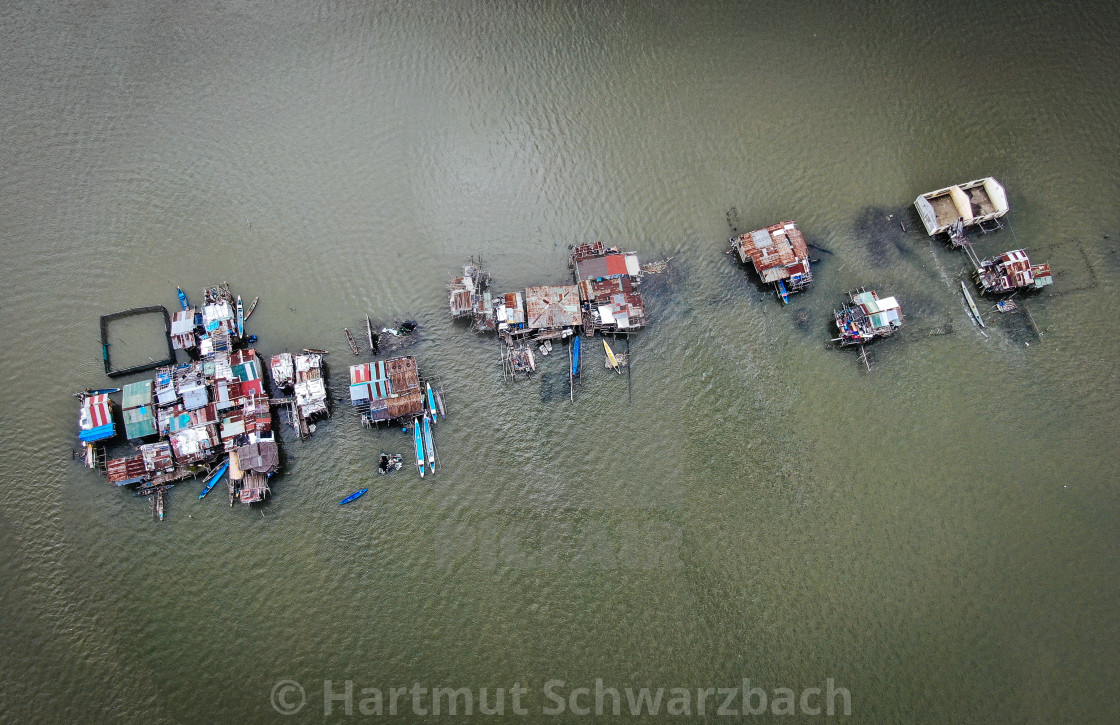 "Sinking Villages near Manila Bay" by Hartmut Schwarzbach - $103.77 "Sinking Villages near Manila Bay" stock image