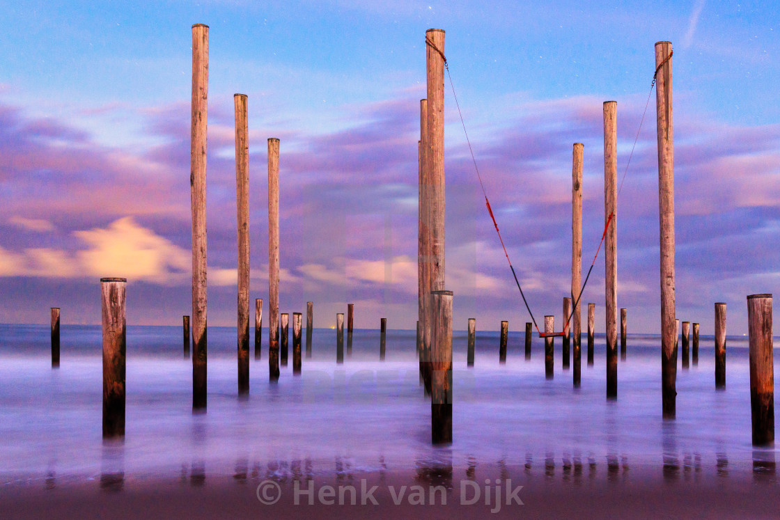 "Sky line with clouds during full moon at Palendorp Petten in the North Sea" stock image