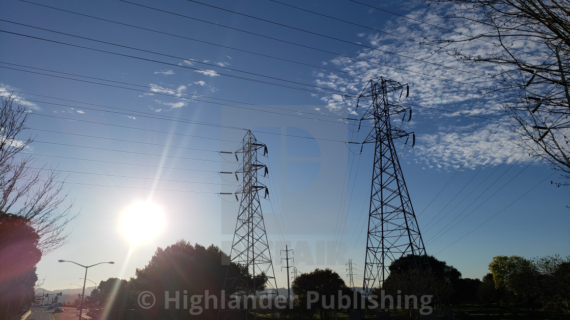 "Electrical Towers with Sun" stock image