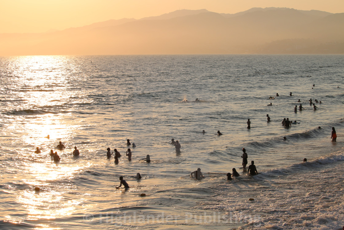 "Beachgoers at Sunset" stock image