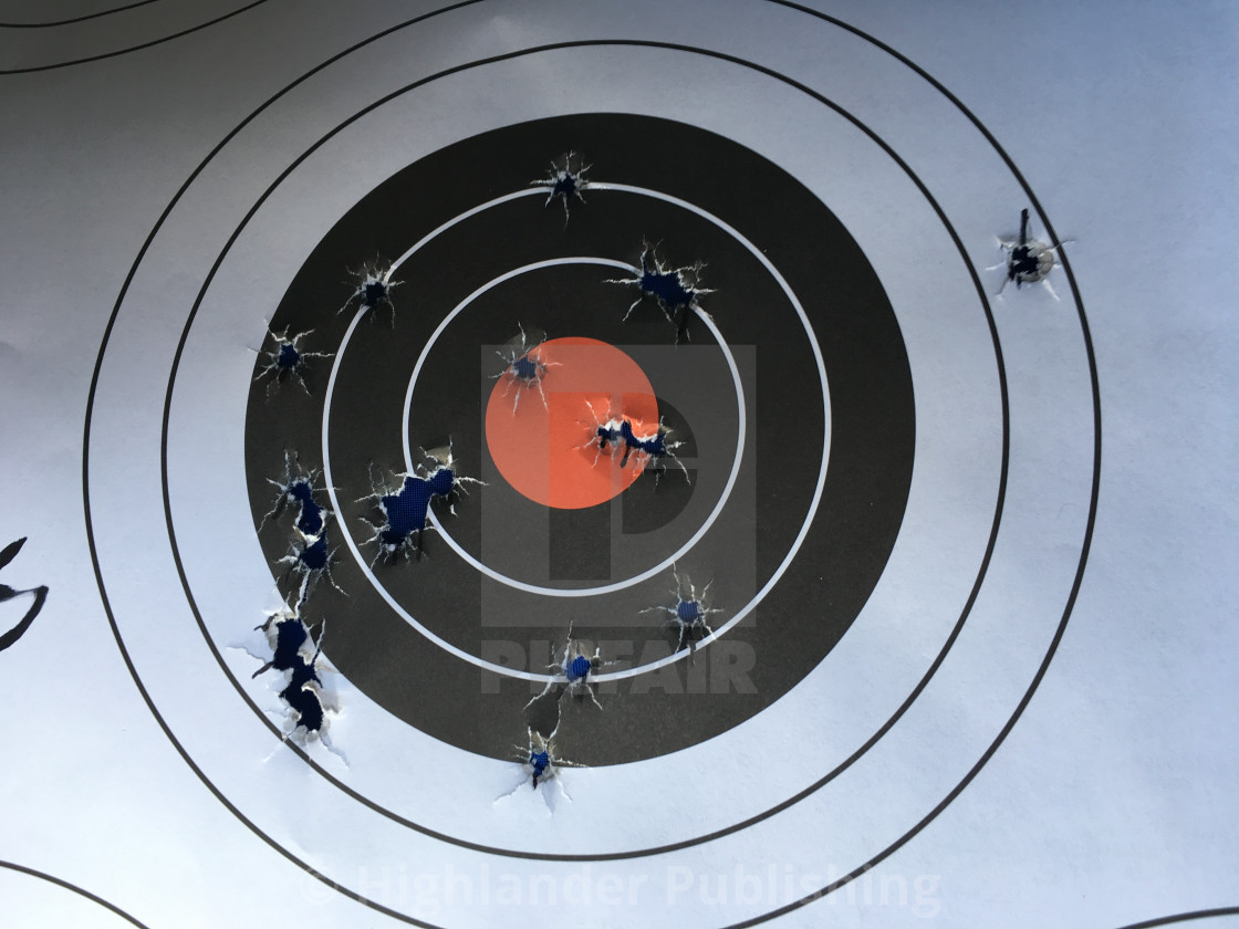 "Bullet Holes in Paper Target" stock image