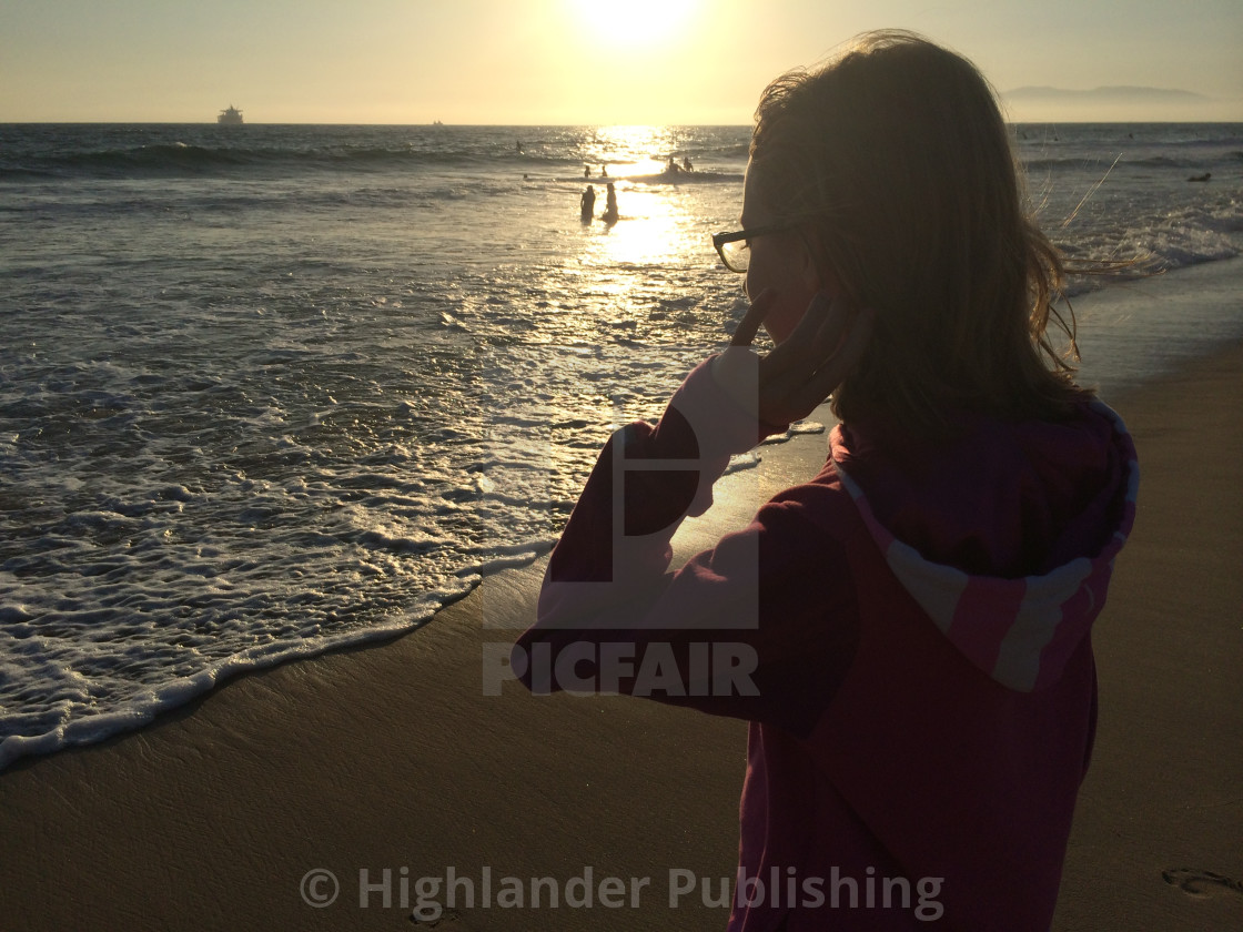 "Girl at Beach Silhouette" stock image