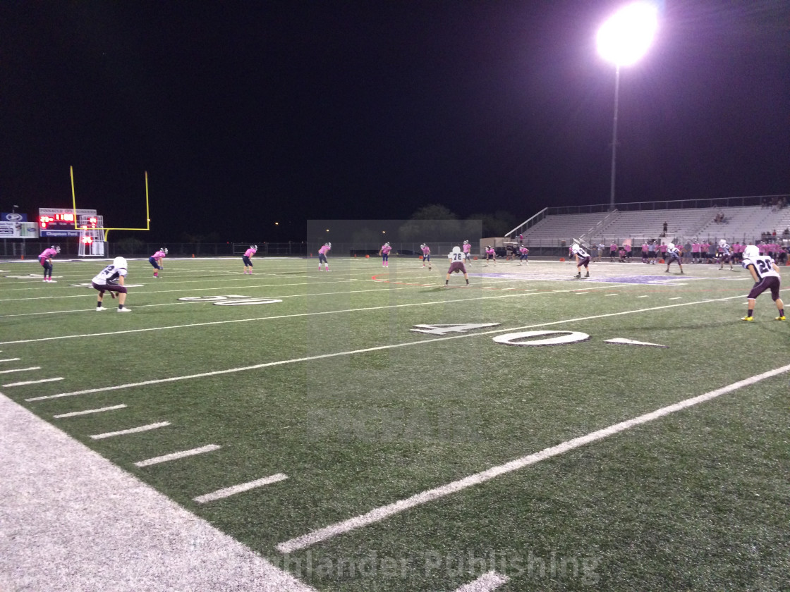 "Junior American Football Game at Night" stock image