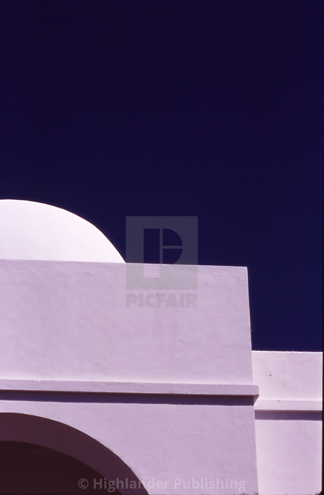 "White Building Against Blue Sky" stock image