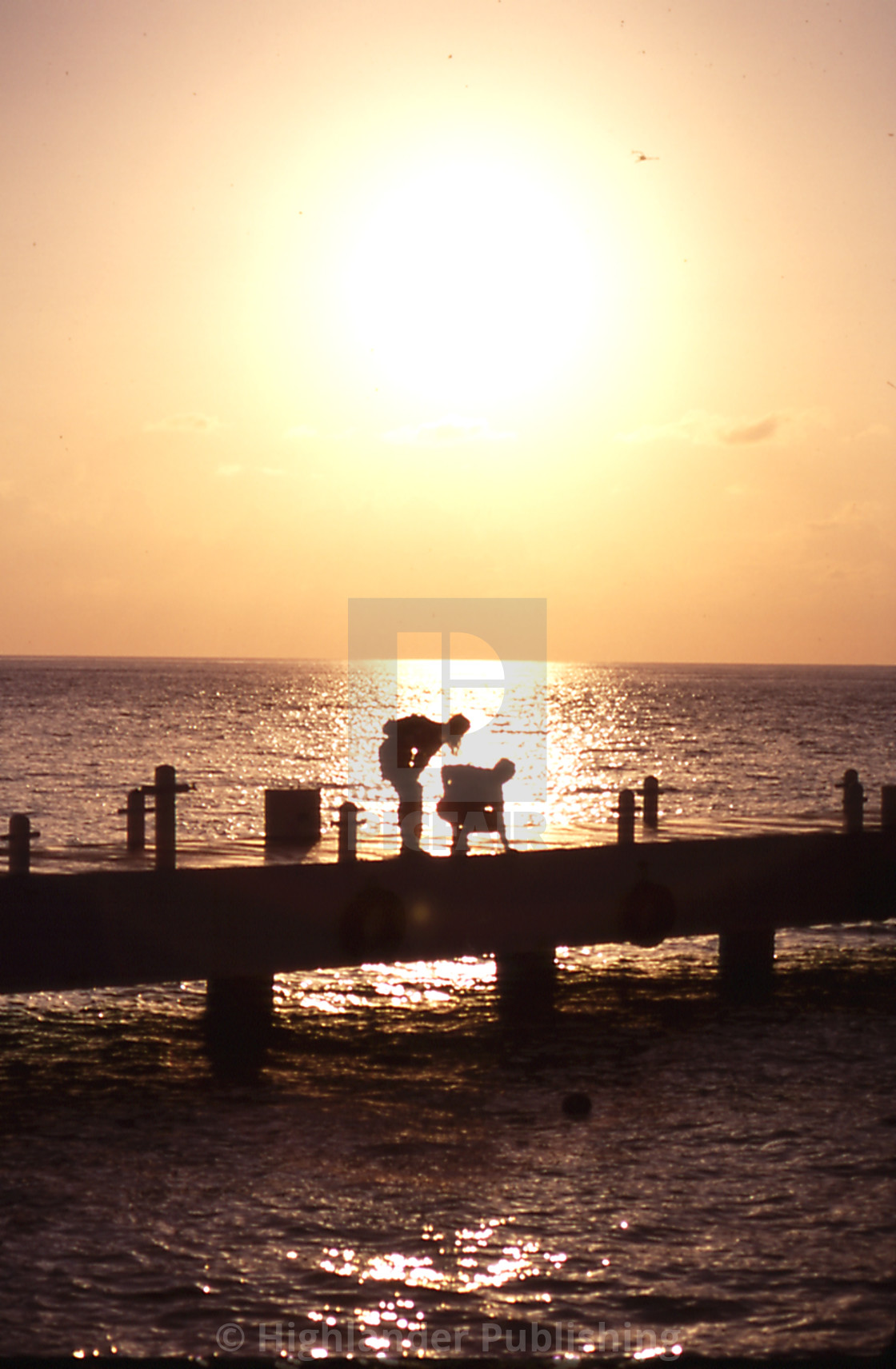 "Couple at Sunset on Pier" stock image