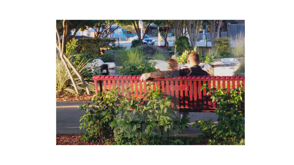 "Couple on red bench" stock image