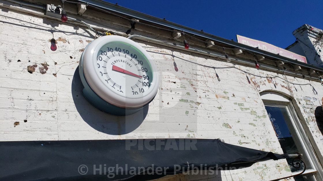 "Vintage temperature gauge on old wall" by Highlander Publishing - $12.57 "Vintage temperature gauge on old wall" stock image