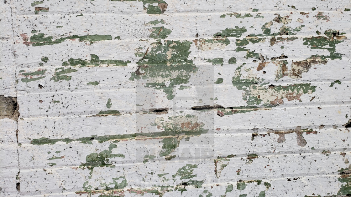 "Peeling paint on brick wall" stock image