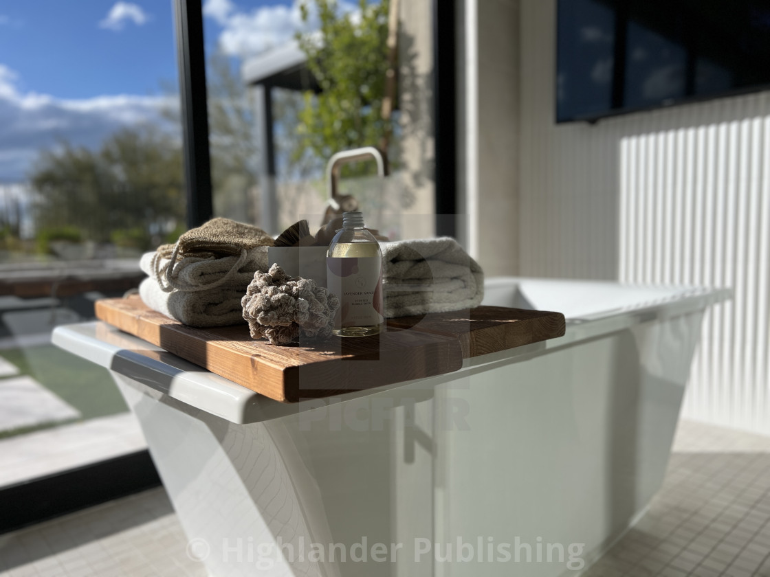 "Freestanding luxury tub in custom bath" by Highlander Publishing - $7.34 "Freestanding luxury tub in custom bath" stock image