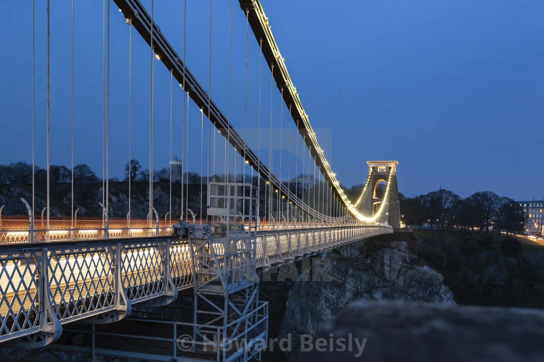 "Details of the Clifton Suspension Bridge set against a dark blue evening sky" stock image