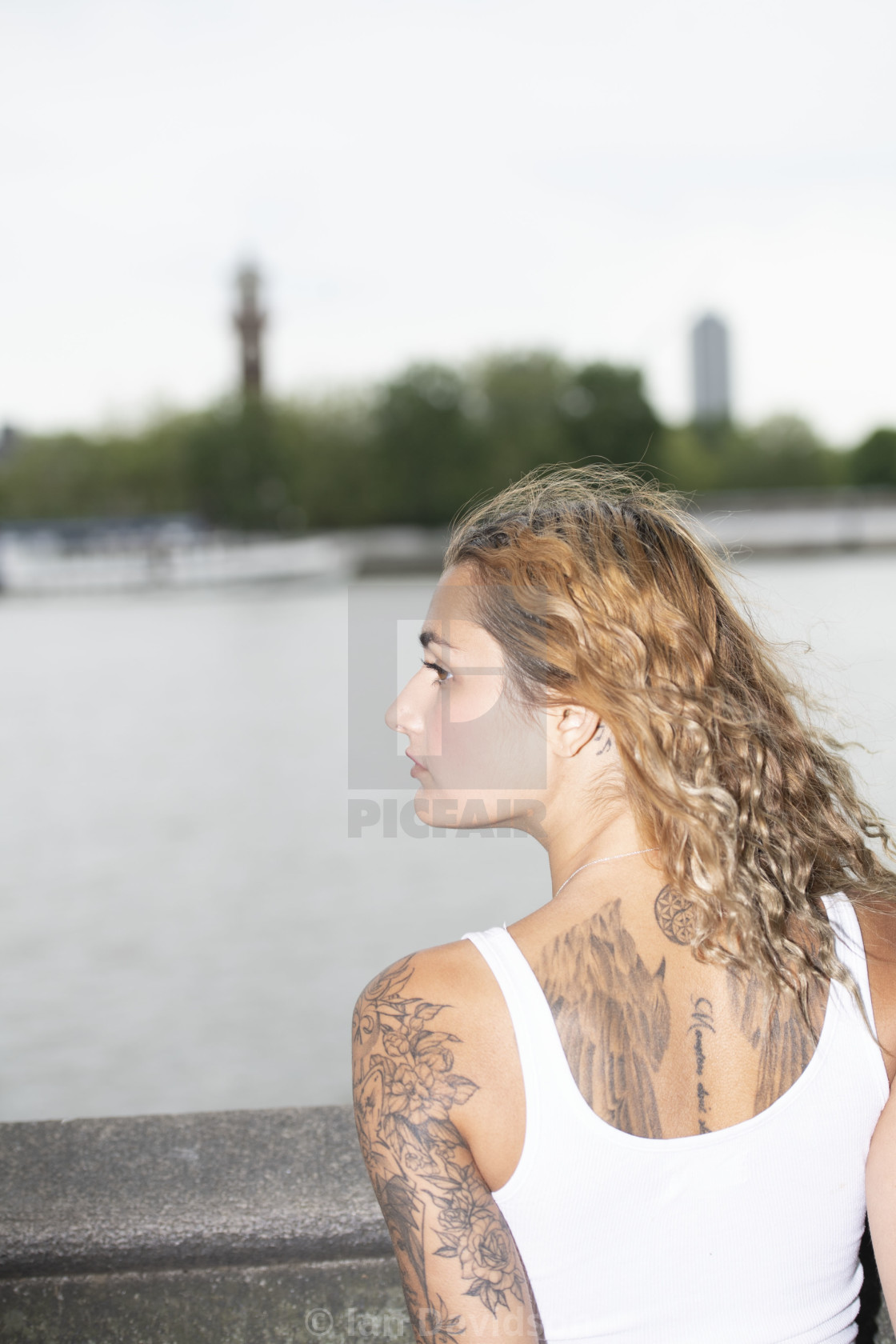 "A girl looks out over the Thames" stock image