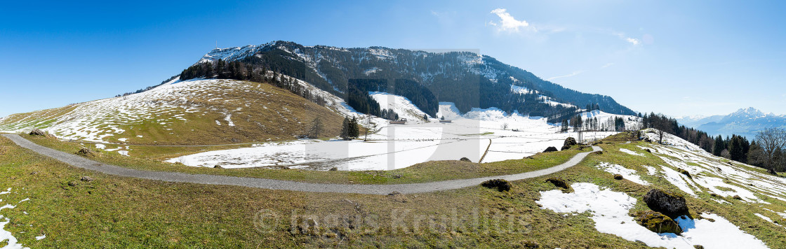 "Great panoramic view of Swiss nature with a trail going around the mountain" stock image