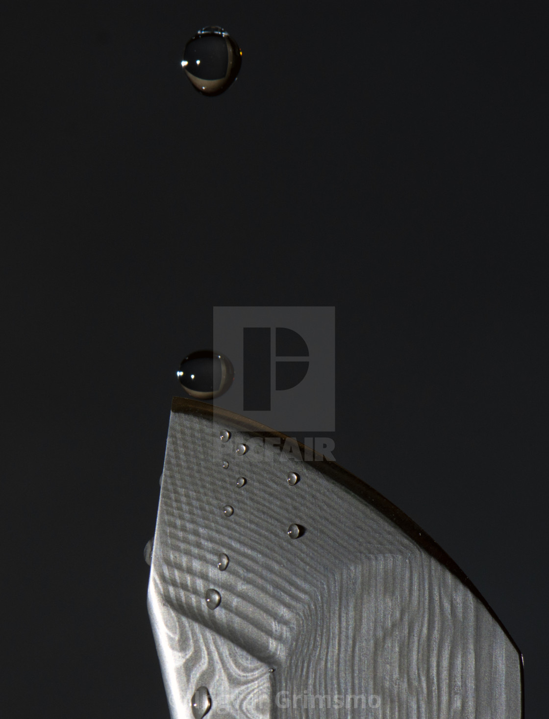 "Water Drops Closing in on a Grimsmo Knives Norseman blade" by Ingvar Grimsmo - $12.70 "Water Drops Closing in on a Grimsmo Knives Norseman blade" stock image