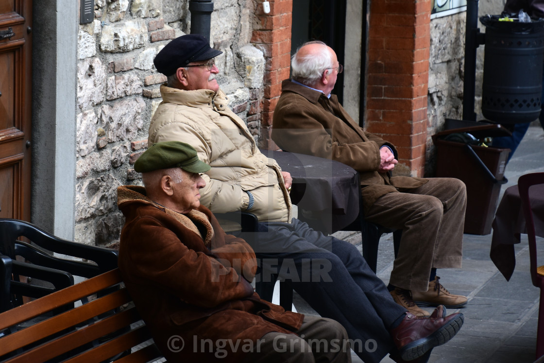 "Older men in an Italian Piazza" stock image