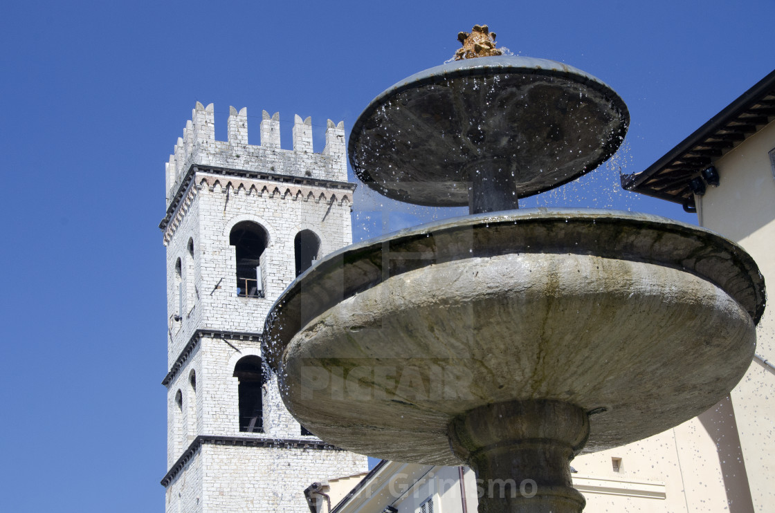 "Fountain and church in Assis, Italy" stock image