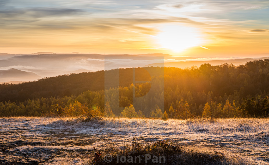 "Sunrise over Transylvanian hills" stock image