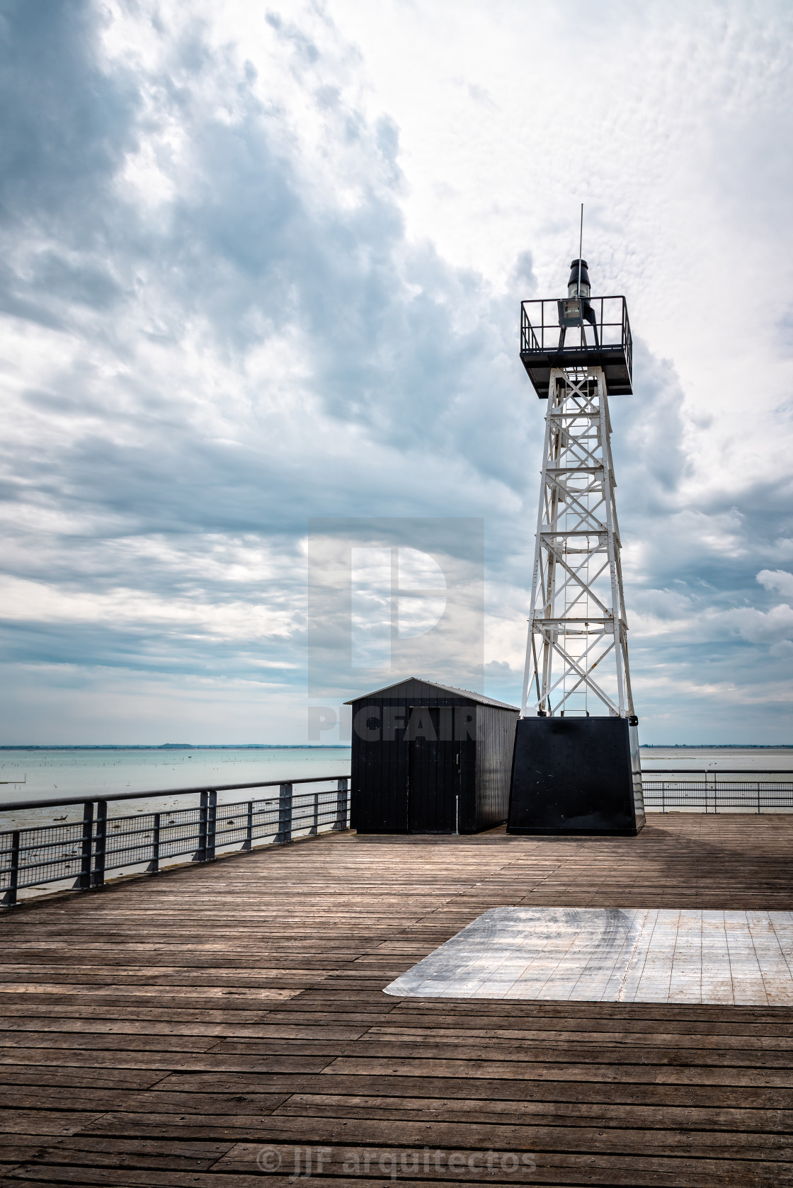 "Lighthouse in the wooden pier of the port of Cancale" stock image