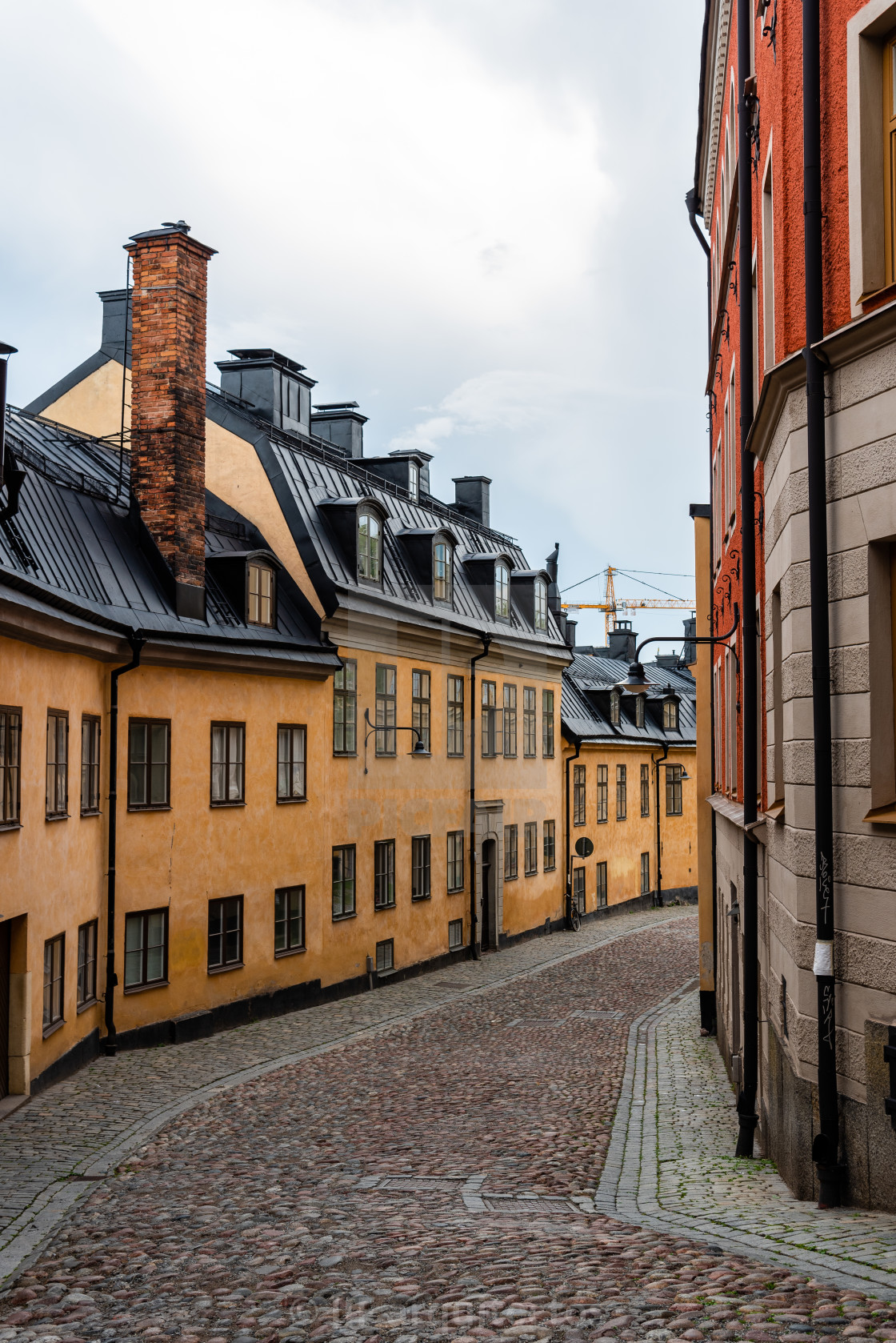 "Picturesque cobblestoned street with colorful houses in Sodermalm in Stockholm" stock image